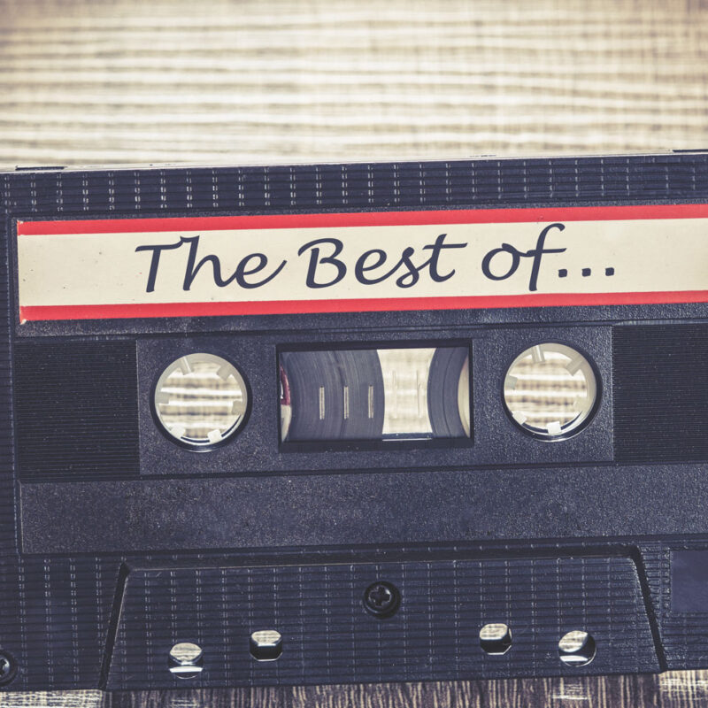 Vintage cassette tape with purple headphones and The Best of label