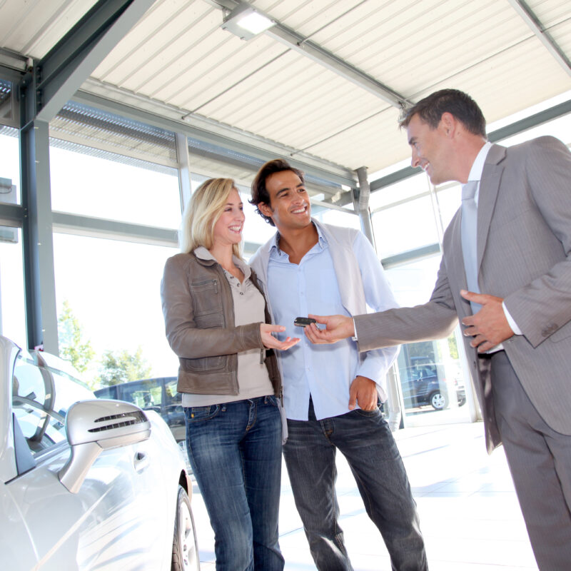 Modern commercial metal building car showroom with customers