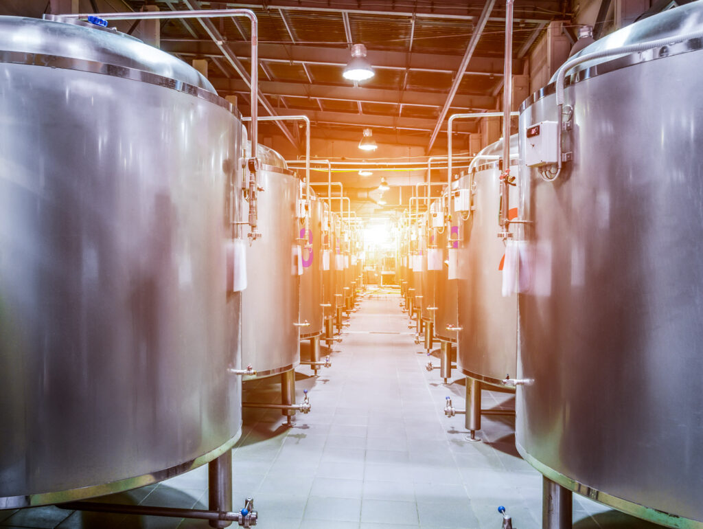 Stainless steel tanks inside a metal building facility
