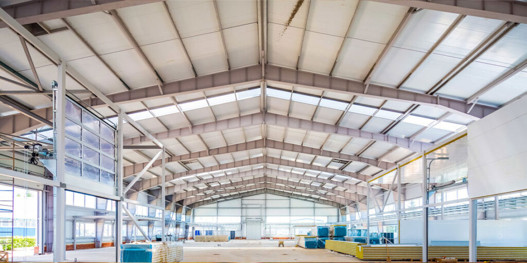 Steel building interior with large open-span roof structure
