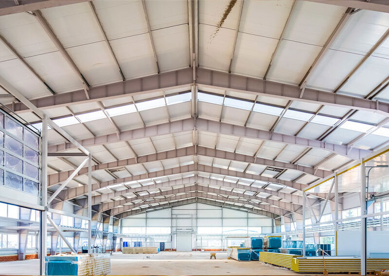 Steel building interior with large open-span roof structure