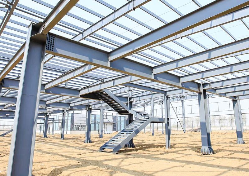 Steel building frame under construction with multiple staircases