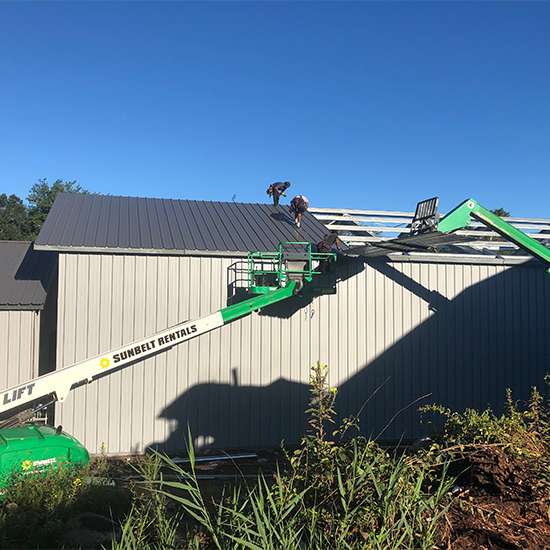 Metal shed construction on roof