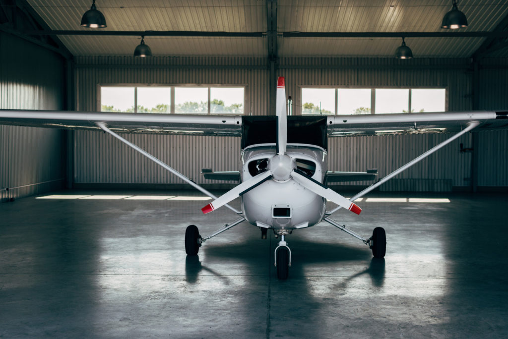 modern-small-airplane-standing-in-hangar