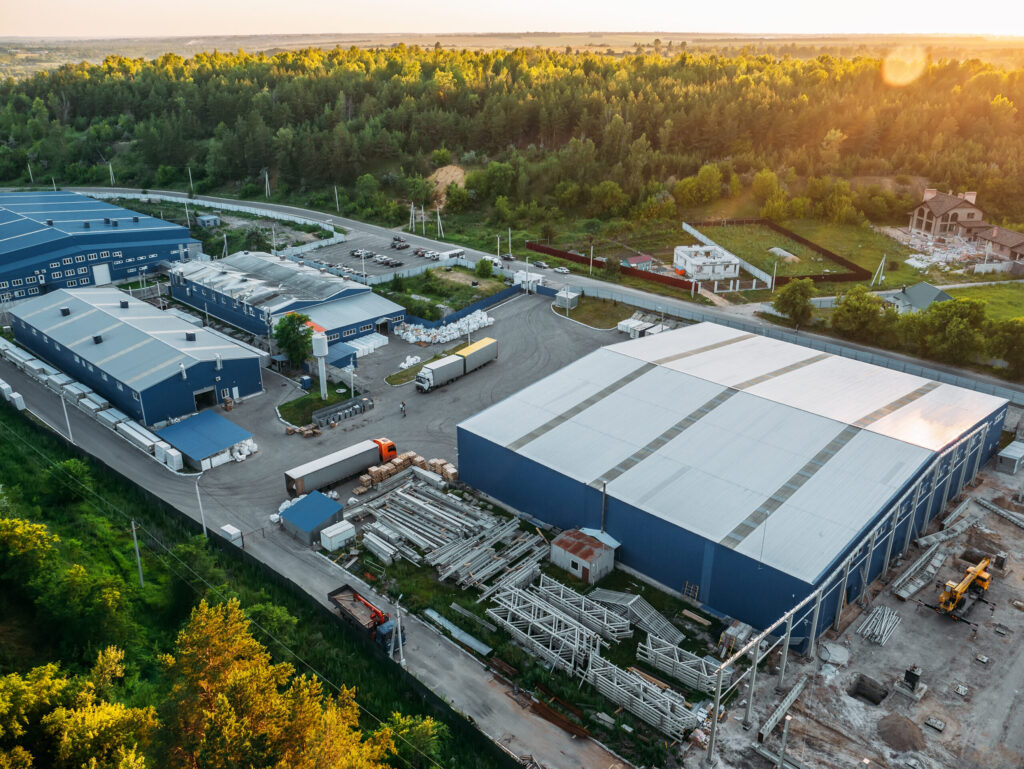 Aerial view of large steel buildings under construction