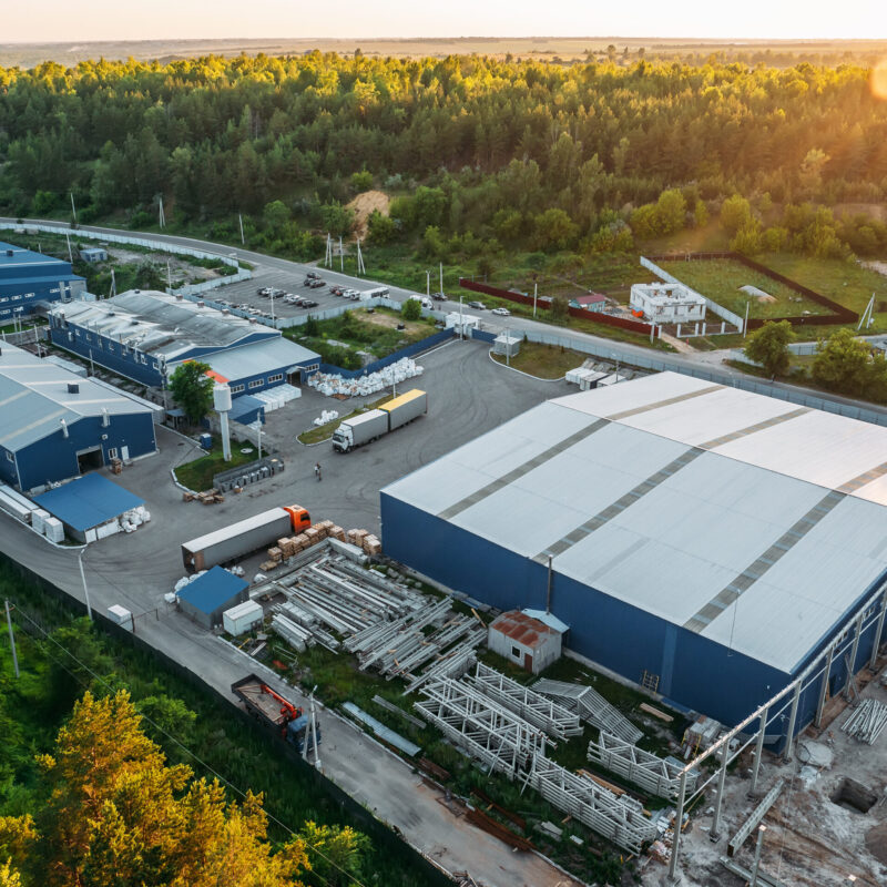 Aerial view of large steel buildings under construction
