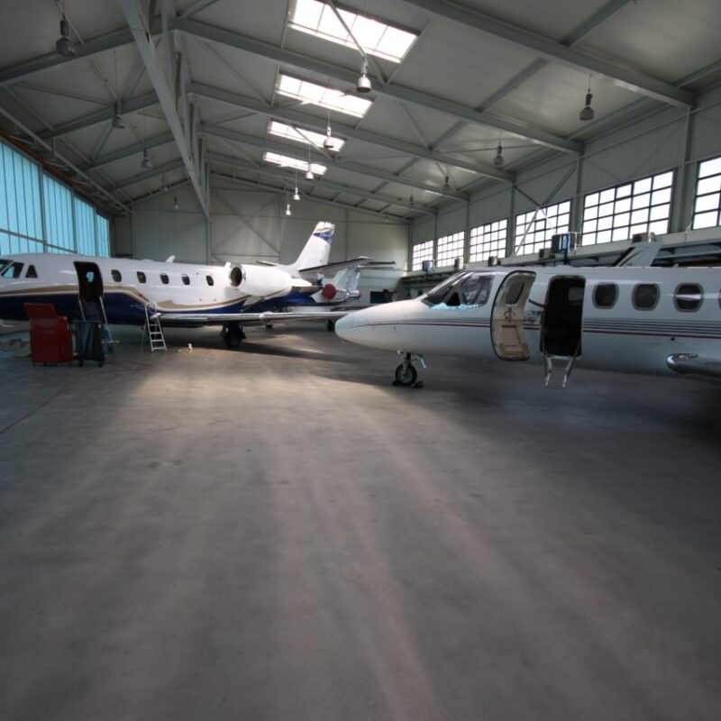 Aircraft hangar with two private jets inside