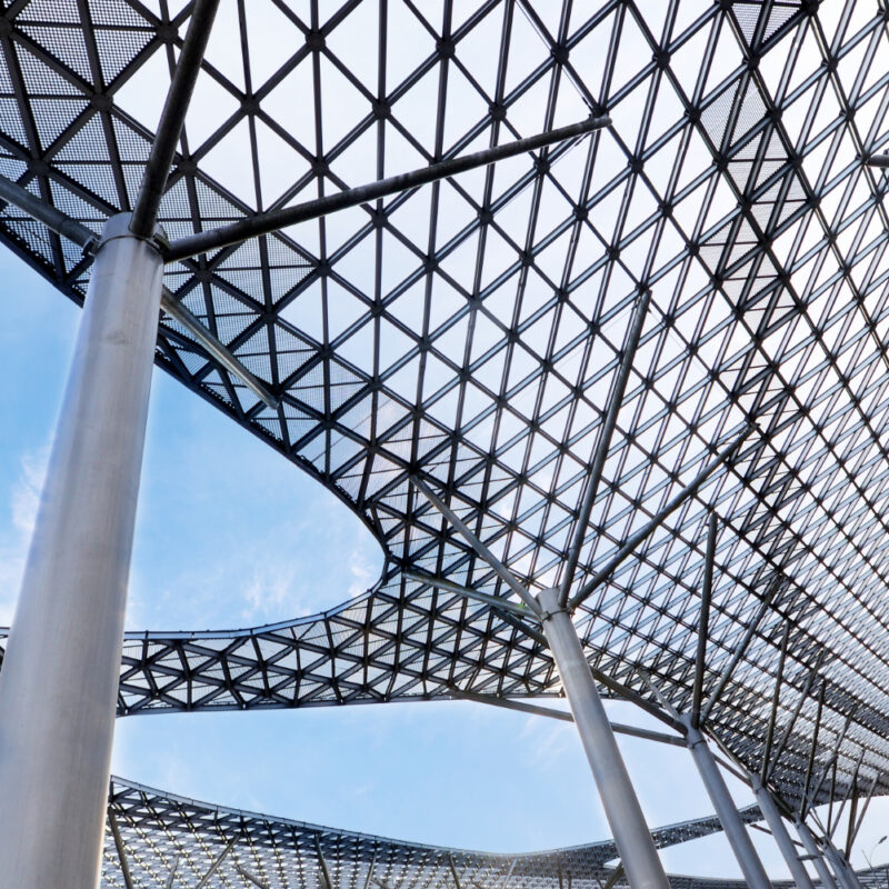 Steel architectural canopy with lattice roof structure