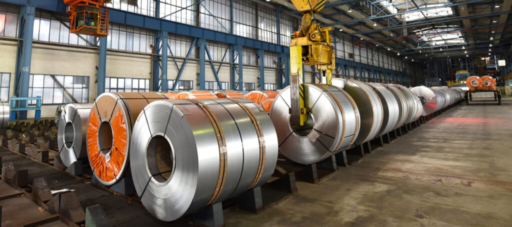 Steel coils stored inside a metal building warehouse