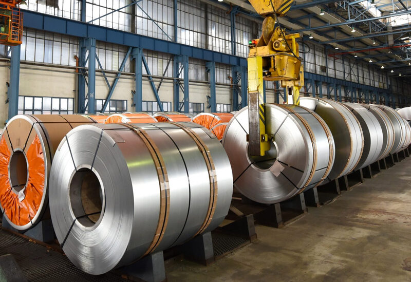 Steel coils stored inside a metal building warehouse