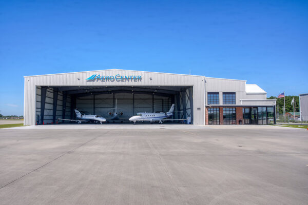 Aircraft hangar with jets and office building