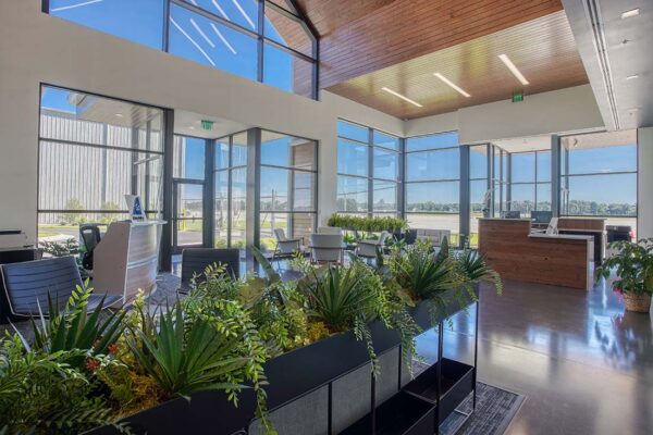 Modern commercial metal building lobby with large windows