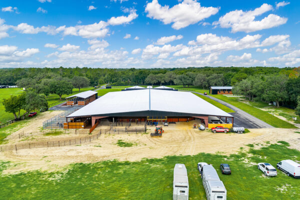 Aerial shot of a steel horse arena building with a clear span interior
