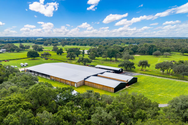 Aerial view of a covered riding arena providing weather protection and open space