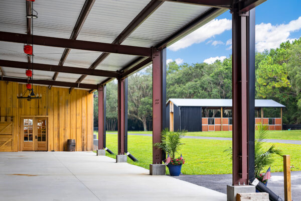 Exterior of a steel horse arena building used as a roping arena