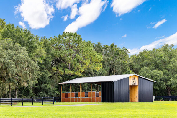 Exterior of a steel horse arena building used as a roping arena