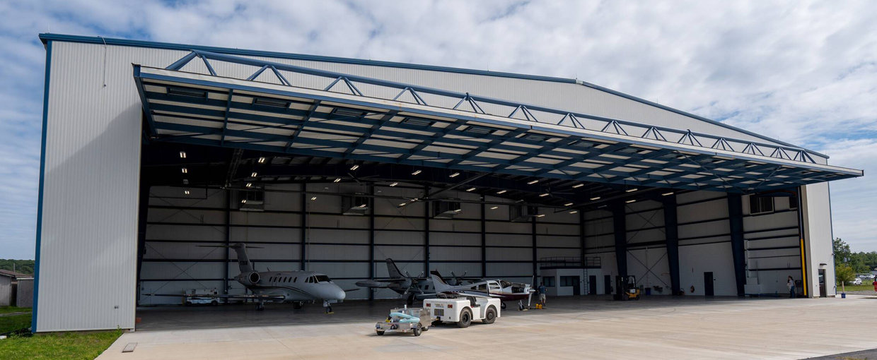 Aircraft hangar for small planes, steel building exterior