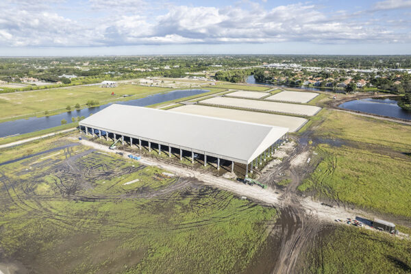 Wide aerial view showing the full scale of the new covered arena at Wellington International