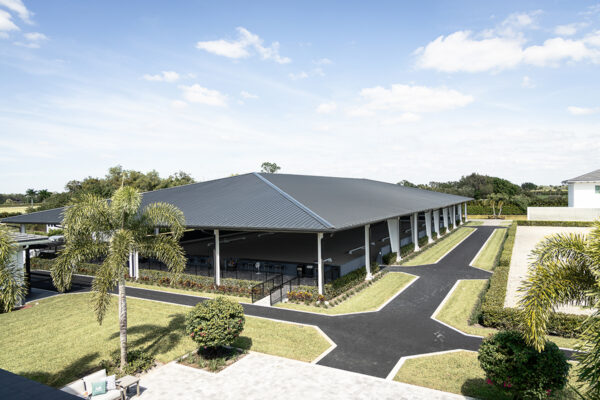 Interior equestrian steel building with refined riding arena look