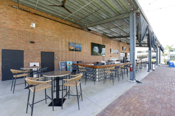 Exterior brewery and restaurant featuring connected outdoor patio