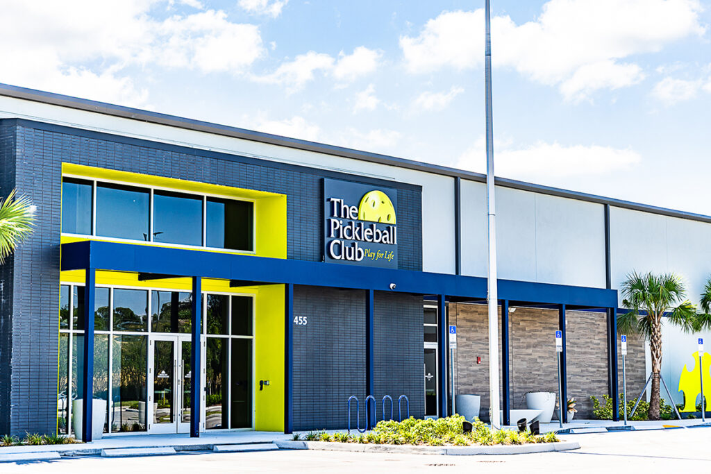 Front entrance of a metal recreational building for indoor pickleball