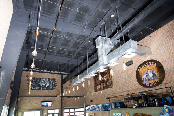 Interior view of brewery production space with exposed steel framing