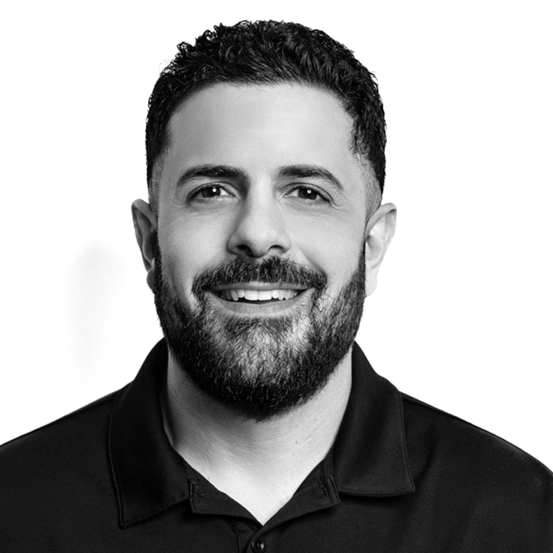 Smiling man portrait in black polo shirt