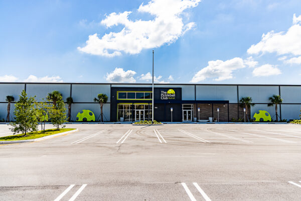 Prefab steel building housing an indoor pickleball stadium
