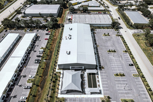 Aerial view of commercial metal buildings with parking lot