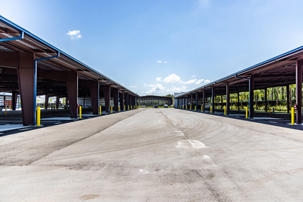 Steel commercial covered parking structure with open bays