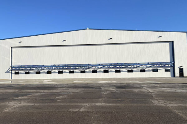 Steel aircraft hangar with large front door