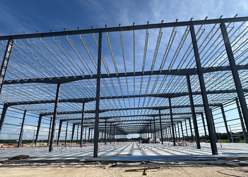 Steel building frame under construction with wide-open interior structure