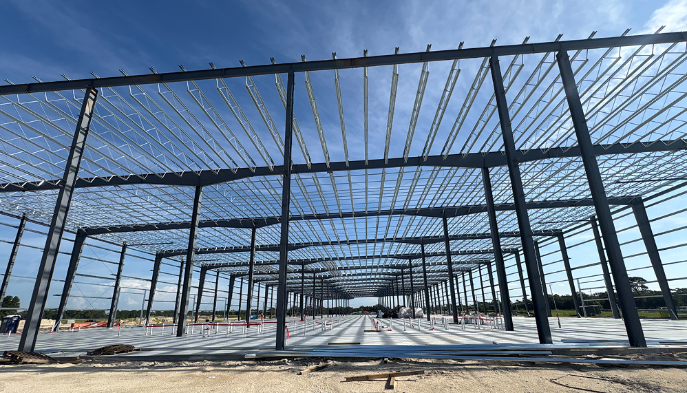 Steel building frame under construction with wide-open interior structure