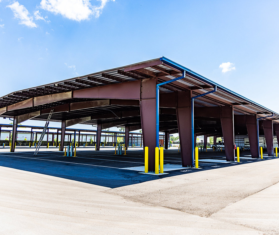 Pre engineered metal building with open canopy structure