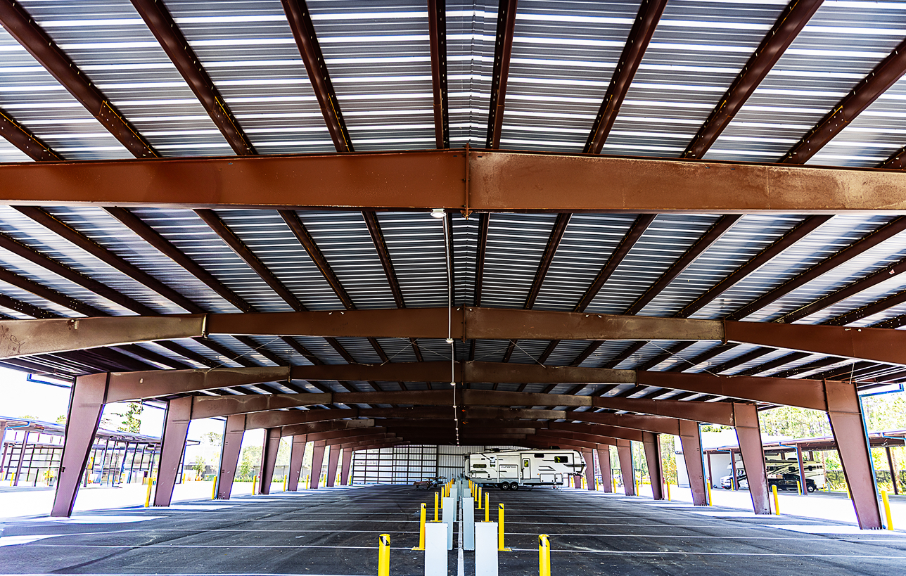 Steel commercial metal building with covered parking structure