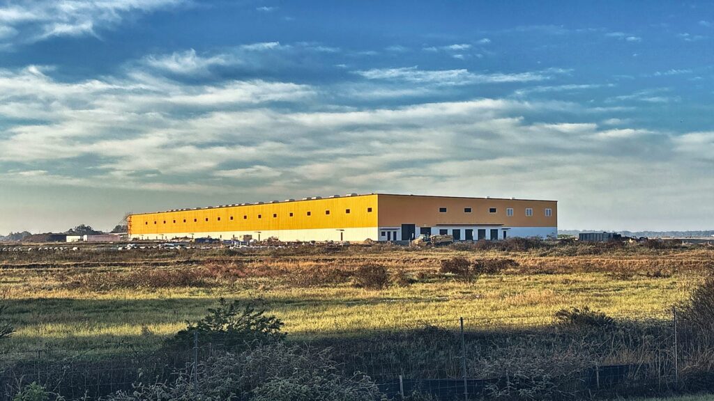 Bauducco Foods pre-engineered metal building with custom yellow panels in Zephyrhills, FL