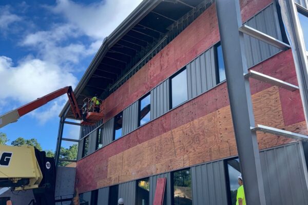 Fiber cement panels being installed on the Ruby-Collins metal office building in Smyrna, GA