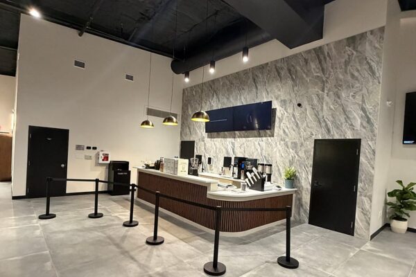 Wide view of the Zion Church lobby showing the coffee bar, welcome table, and lounge area