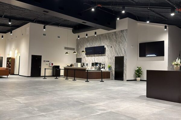 Coffee bar with a stone accent wall and pendant lighting in the Zion Church lobby