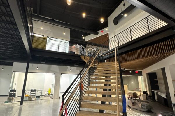 Open feature stair beneath a skylight inside the Ruby-Collins metal office building in Smyrna, GA