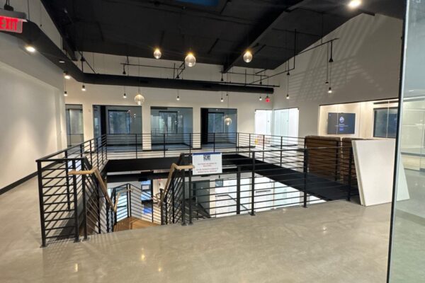 Exposed second floor steel framing inside the Ruby-Collins metal office building under construction in Smyrna, GA