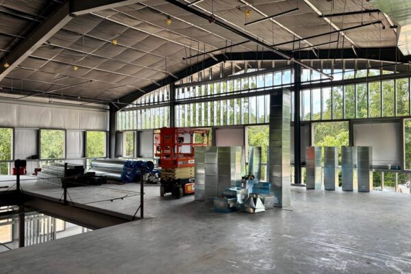 Exposed second floor steel framing inside the Ruby-Collins metal office building under construction in Smyrna, GA